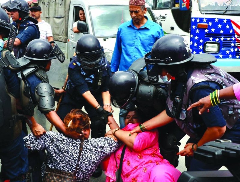 File - Police attempt to move cooperative finance victims from the streets during their protest demanding refund after multiple finance companies did not return their money, in Kathmandu, on Thursday. Photo: Skanda Gautam / THT